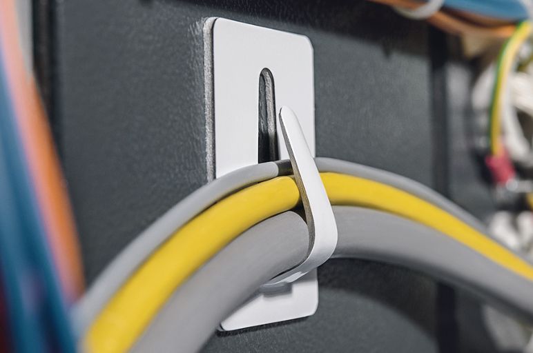 Steel cable clamp, self-adhesive