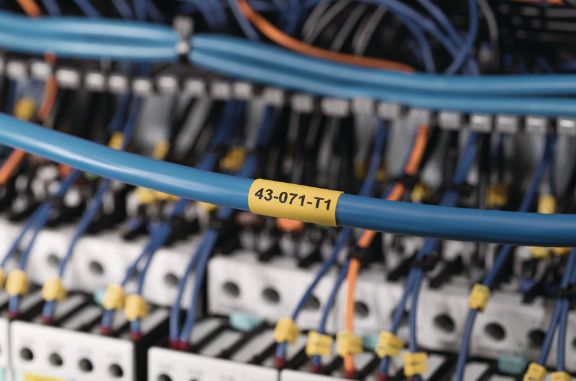Heat shrink labels with low fire hazard for rail applications